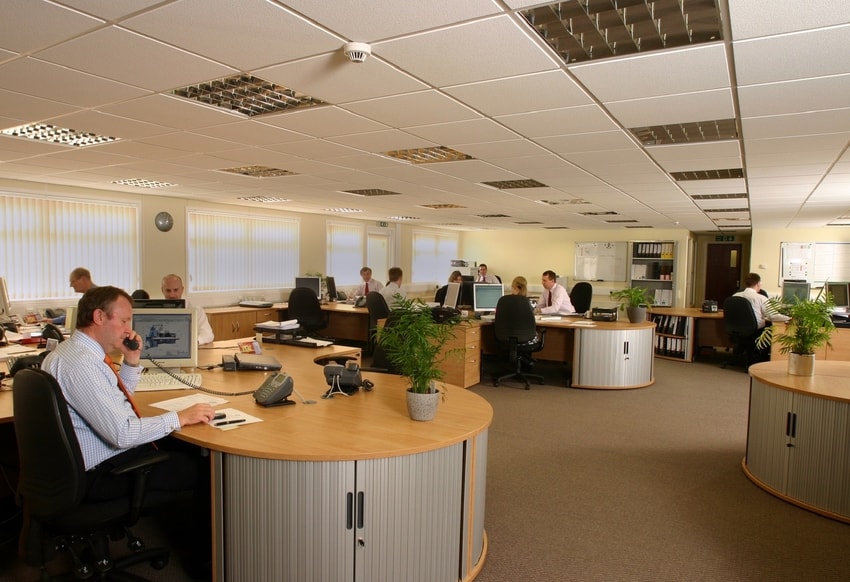 Professional office with busy workers and professionally cleaned carpeting