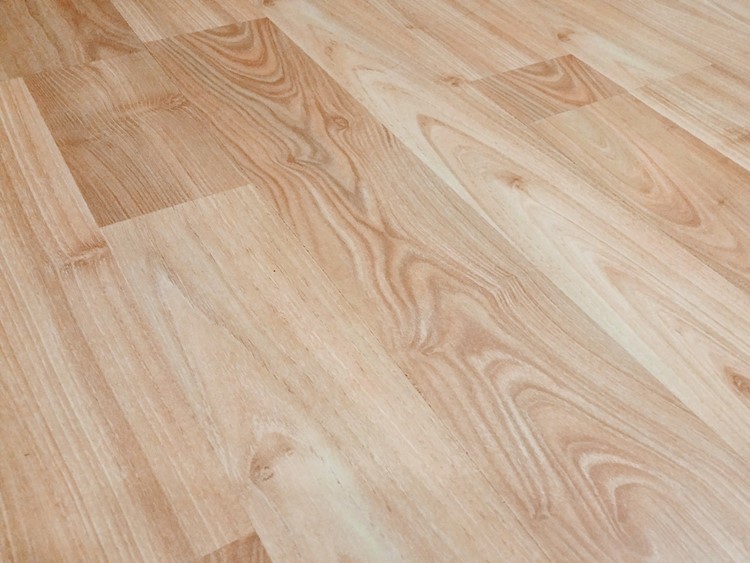 Closeup view of light-colored hardwood flooring