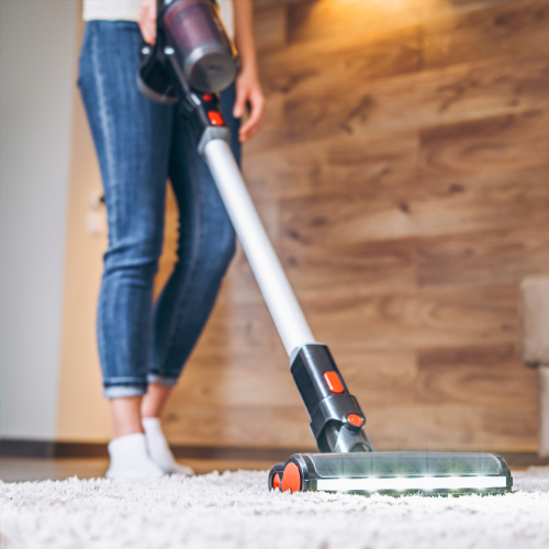 lady vacuuming carpet