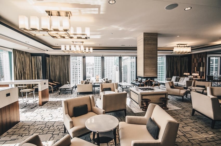 Lobby of nice hotel with furniture and immaculately cleaned carpeting