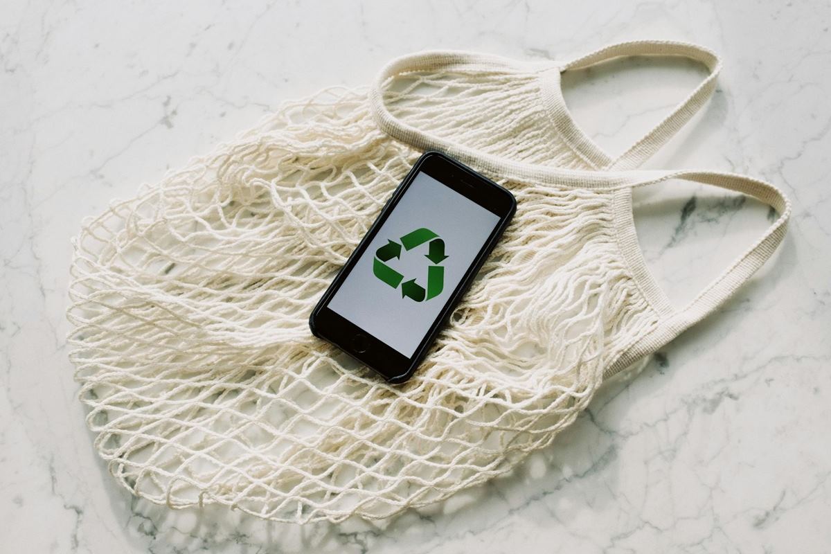 Image of a phone with a recycling app open