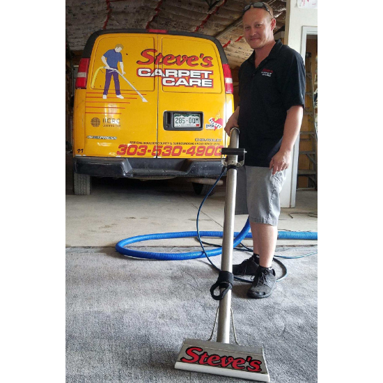 IICRC certified carpet cleaning technician operating a truck mounted system